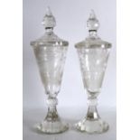 A GOOD PAIR OF 19TH CENTURY BOHEMIAN CLEAR GLASS GOBLETS AND COVERS engraved with stags roaming