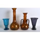 AN UNUSUAL TWIN HANDLED SMOKEY AMBER GLASS VASE together with three other glasses. Largest 10.5ins