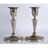 A PAIR OF ENGLISH NEO CLASSICAL SILVER CANDLESTICKS. Birmingham 1972. 7.25ins high.