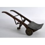 A LOVELY NOVELTY EDWARDIAN CARVED WOOD SACK BARROW with central swivel wheel. 10Ins wide.