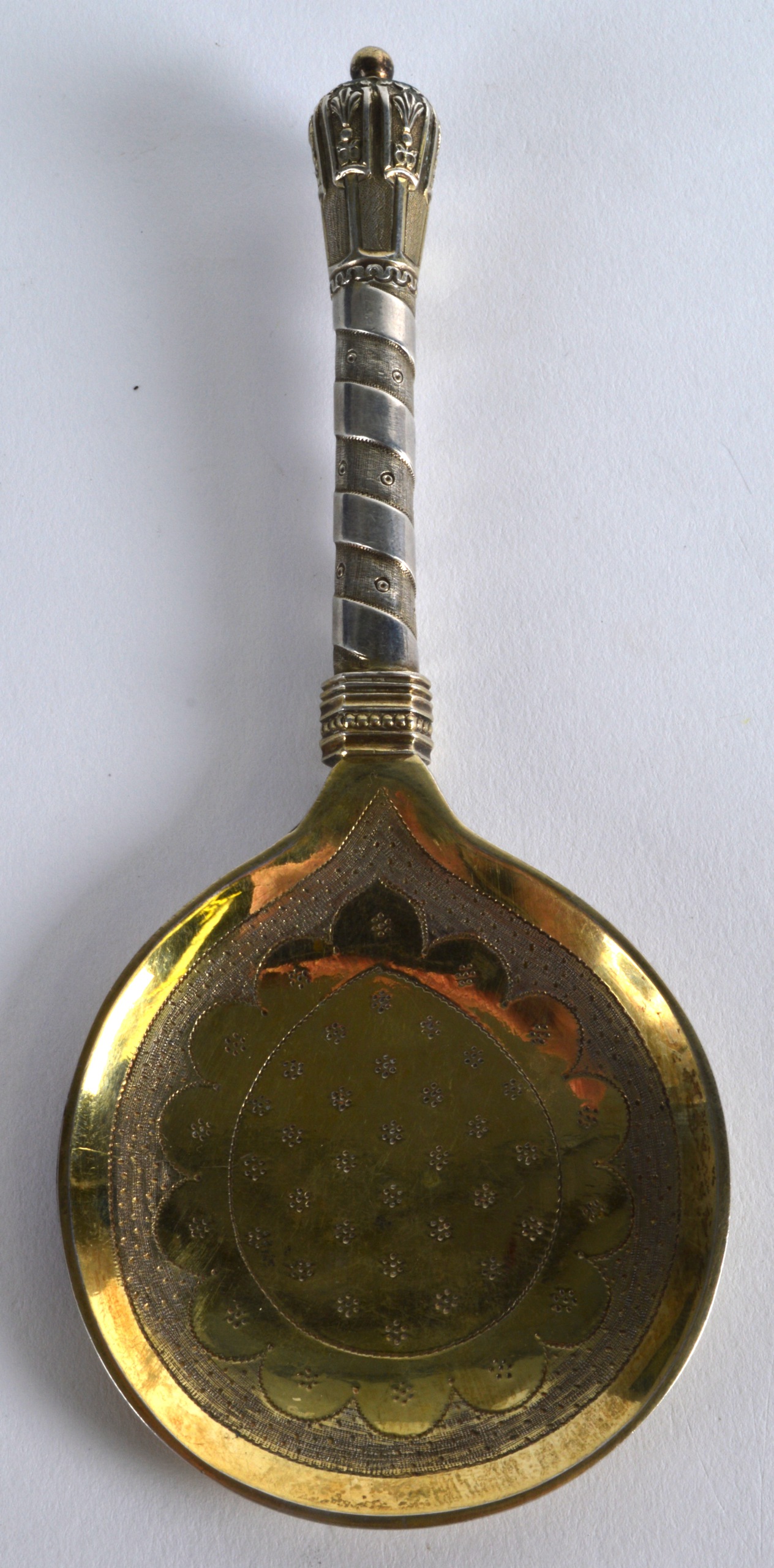 A 19TH CENTURY EUROPEAN SILVER GILT SPOON possibly Russian, with twist handle. 6.5ins long.
