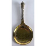 A 19TH CENTURY EUROPEAN SILVER GILT SPOON possibly Russian, with twist handle. 6.5ins long.