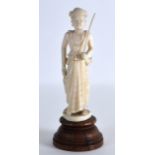 A LATE 19TH/20TH CENTURY CARVED BURMESE IVORY FIGURE OF A FEMALE modelled in incised robes. Ivory