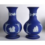 A PAIR OF 19TH CENTURY WEDGWOOD JASPERWARE BULBOUS VASES decorated with classical figures beside