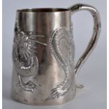 A LATE 19TH CENTURY CHINESE EXPORT SILVER MUG by Po Cheng, decorated in relief with a dragon. 3oz.