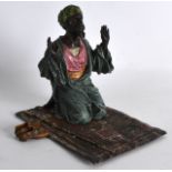 AN AUSTRIAN COLD PAINTED BRONZE FIGURE OF AN ARAB in the Bergmann style, modelled upon a carpet. 5.