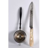 A 19TH CENTURY CONTINENTAL SILVER STRAINING LADLE together with silver bladed mother of pearl knife.