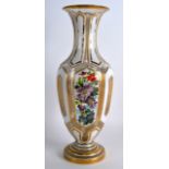 A LATE 19TH CENTURY BOHEMIAN WHITE ENAMEL AND GILT VASE decorated with panels of gilt scrolls and