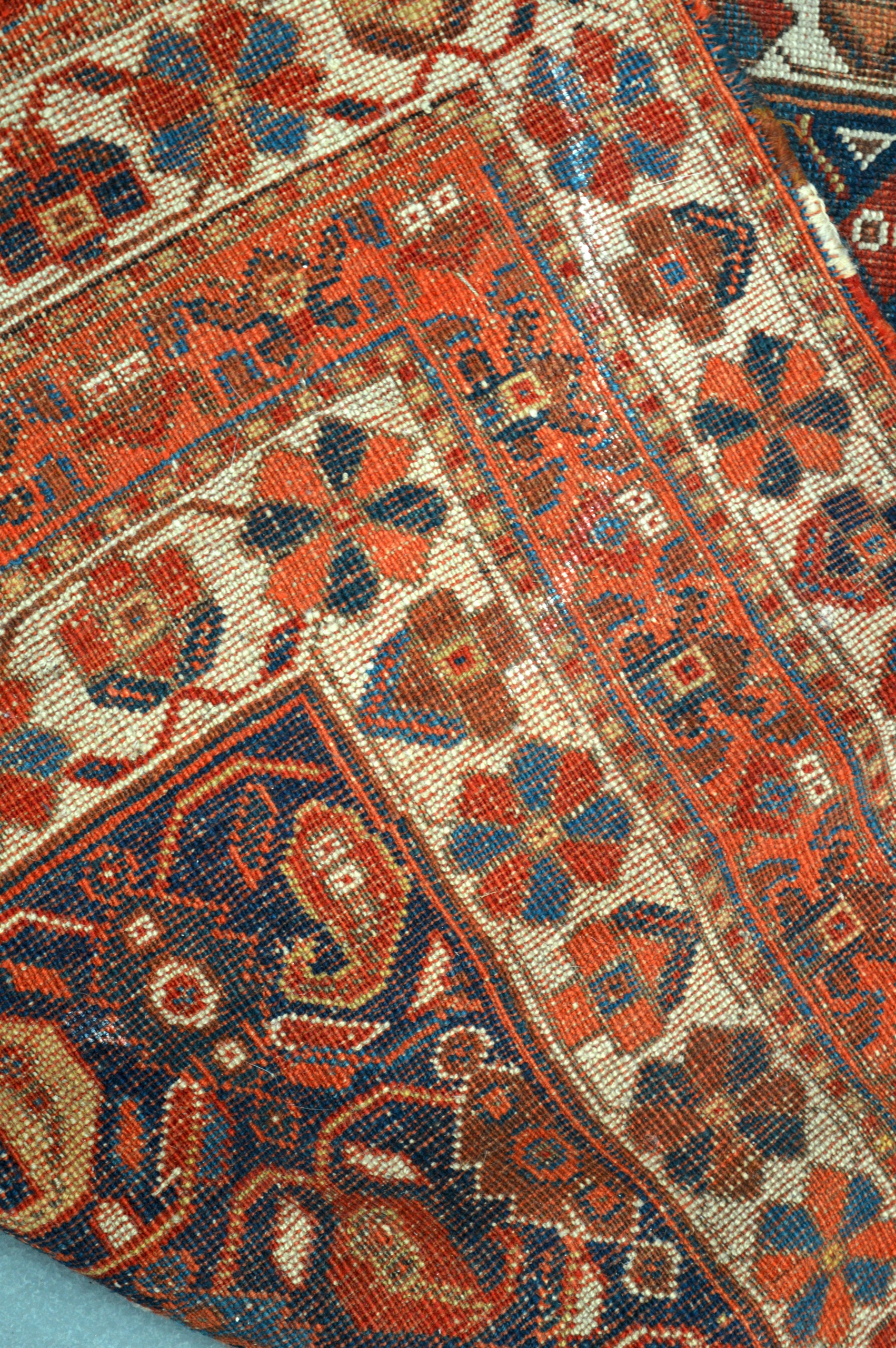 A BLUE AND YELLOW GROUND EASTERN RUG decorated with medallions. 5Ft 4ins x 4ft 1ns. - Image 3 of 3