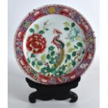 A LATE 19TH CENTURY CHINESE FAMILLE ROSE SCALLOPED PLATE Guangxu, painted with a phoenix bird