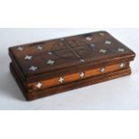 AN 18TH/19TH CENTURY CARVED RECTANGULAR WOODEN BOX inset in mother of pearl with religious motifs.