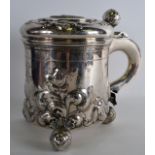 A LATE 18TH CENTURY SCANDANAVIAN SILVER PEG TANKARD the top inset with a coin, decorated in relief