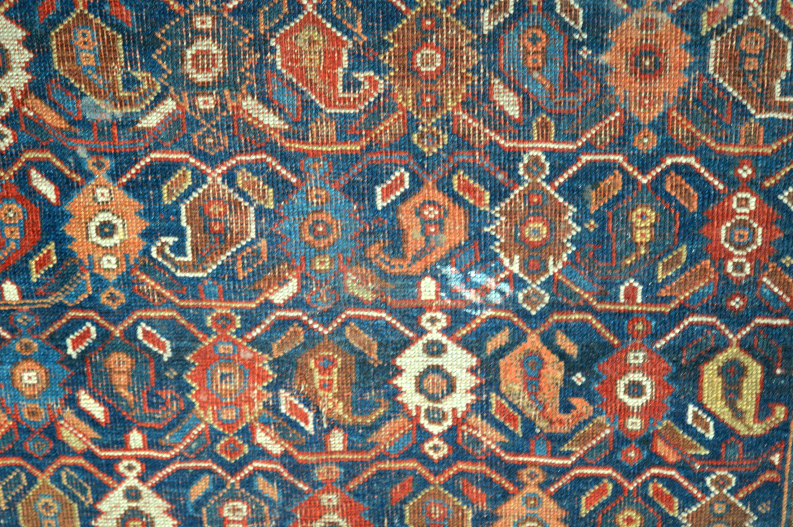 A BLUE AND YELLOW GROUND EASTERN RUG decorated with medallions. 5Ft 4ins x 4ft 1ns. - Image 2 of 3