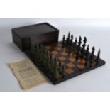 A RARE EARLY 20TH CENTURY GREEN AND BLACK PAINTED LEAD CHESS SEAT with gaming board. (qty)