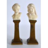 A LOVELY PAIR OF EARLY 20TH CENTURY FRENCH ART NOUVEAU IVORY BUSTS supported upon slender bronze