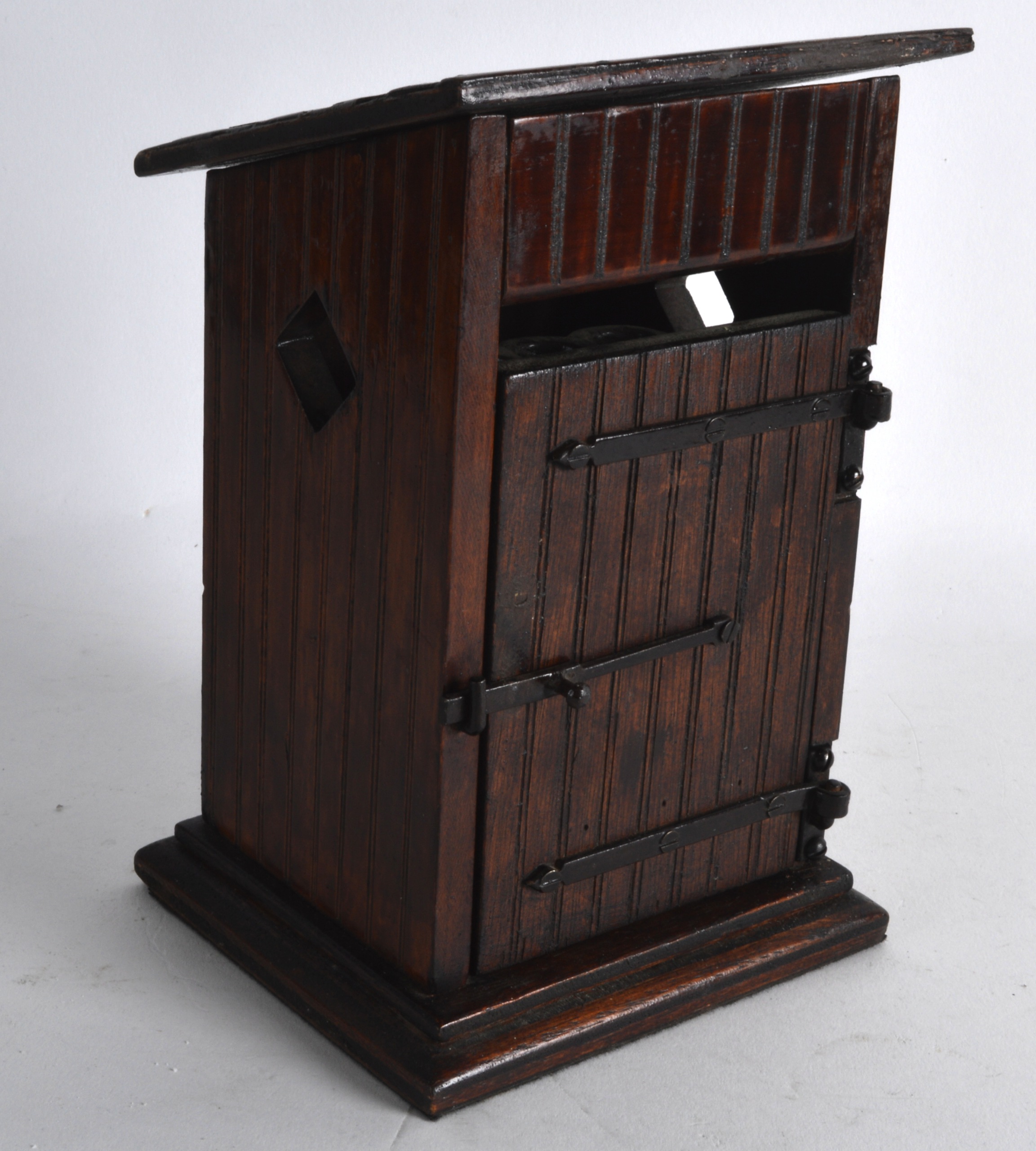 AN UNUSUAL LATE 19TH/20TH CENTURY CARVED WOOD DESK TIDY in the form of an outside toilet, with