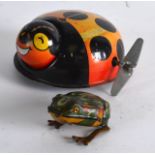 A 1960S JAPANESE TIN PLATE WIND UP LADYBIRD together with tin plate 'drgm' frog. 3.25ins & 1.5ins