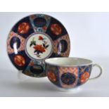 AN 18TH CENTURY WORCESTER TEACUP AND SAUCER painted with a version of the 'Rich Old Mosaic