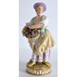 A 19TH CENTURY MEISSEN PORCELAIN FIGURE OF A GIRL modelled holding a basket of flowers. 6.5ins