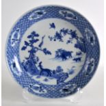 AN EARLY 20TH CENTURY CHINESE BLUE AND WHITE SHALLOW DISH bearing Kangxi marks ot base, delicately