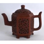 A GOOD CHINESE QING DYNASTY RETICULATED YIXING TEAPOT AND COVER of hexagonal form, with pierced