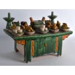 A CHINESE TANG DYNASTY SANCAI GLAZED OFFERING TABLE of large proportions, the top decorated with