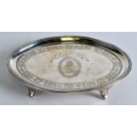 A GEORGE III SILVER TEAPOT STAND engraved with vines and motifs. 6.25ins wide.