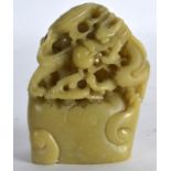 AN EARLY 20TH CETURY CHINESE CARVED SOAPSTONE DRAGON SEAL. 3.5ins high.