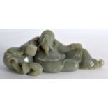 A CHINESE CARVED GREEN JADE FIGURE OF A RECUMBANT BEARDED MALE modelled holding a vessel. 6.5ins