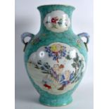 A CHINESE FAMILLE ROSE TWIN HANDLED PORCELAIN VASE bearing Daoguang marks to base, painted with