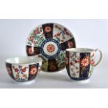AN 18TH CENTURY WORCESTER QUEENS PATTERN TEABOWL COFFEE CUP AND SAUCER painted in the imari style.