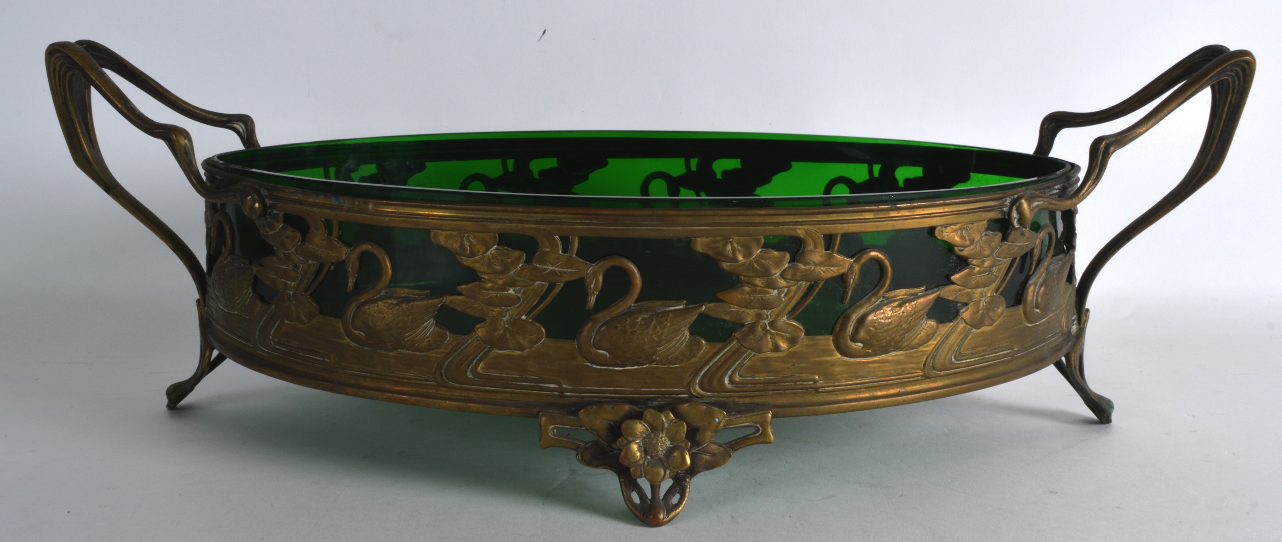 A STYLISH ART NOUVEAU TWIN HANDLED BRASS BOWL Attributed to WMF, decorated with stylised swans and