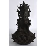 A CHINESE MING DYNASTY BRONZE FIGRE OF A BUDDHA modelled with one hand raised, upon a lotus capped