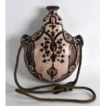 A 19TH CENTURY EASTERN TWIN HANDLED POTTERY FLASK painted with various stylised motifs. 7.5ins