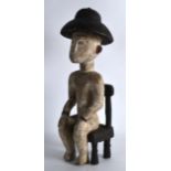 AN EARLY 20TH CENTURY AFRICAN CARVED WOOD FIGURE depicting a colonial male. 1Ft 4.5ins high.