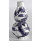 AN EARLY 20TH CENTURY CHINESE PORCELAIN SNUFF BOTTLE decorated with a puce five claw dragon. 3.