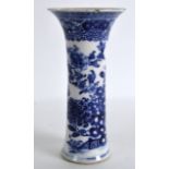 AN 18TH CENTURY CHINESE BLUE AND WHITE FLUTED VASE Qianlong, painted with flowering rock. 6Ins