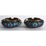 A PAIR OF EARLY 20TH CENTURY CHINESE SILVER AND ENAMEL ASHTRAYS decorated with scrolling foliage and