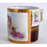 A 19TH CENTURY ROYAL VIENNA COFFEE CAN painted with a winged cherub. 2.5ins high.