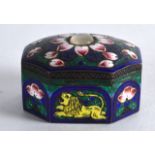 A SMALL EARLY 20TH CENTURY INDIAN SILVER AND ENAMEL PILL BOX decorated with lions and foliage.