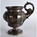 AN EARLY 19TH CENTURY EUROPEAN SILVER TANKARD with stylised handle and ridged body. 9oz. 5.25ins