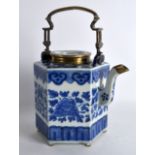 AN EARLY 19TH CENTURY CHINESE BLUE AND WHITE HEXAGONAL TEAPOT AND COVER painted with scrolling