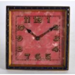 AN ART DECO GEM SET ENAMEL STRUT CLOCK with gilt painted numerals. 3Ins wide.