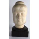 AN 18TH/19TH CENTURY CHINESE CARVED MARBLE BUST OF A FEMALE of large proportions, upon an ebonised