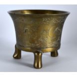 A LATE 19TH CENTURY CHINESE BRONZE CENSER bearing Xuande marks to base, incised with dragons. 550