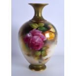 A ROYAL WORCESTER BALUSTER VASE painted with flowers by Austin, C1909, shape 302H. 7.25ins high.