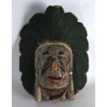 AN EARLY 20TH CENTURY POLYCHROMED WOODEN HEAD in the form of Native American chief. 1Ft 4ins high.