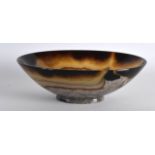 A 19TH CENTURY FRENCH CARVED AGATE BOWL of shallow form. 5.25ins wide.