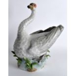 A GOOD EARLY 20TH CENTURY DRESDEN PORCELAIN SWAN boldly modelled upon a naturalistic base. 11.