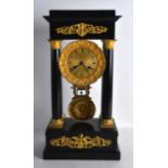 A 19TH CENTURY EUROPEAN CARVED WOOD AND ORMOLU PORTICO CLOCK with cylindrical column supports. 1Ft